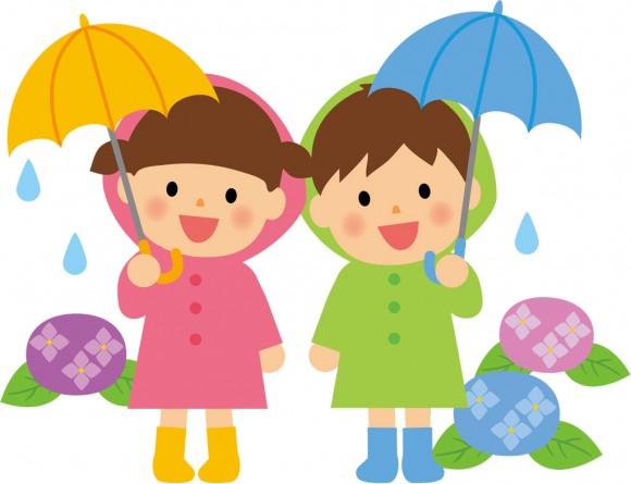 傘をさす男の子と女の子