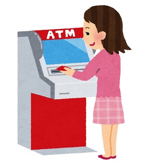 ATMでお金を下ろす女性