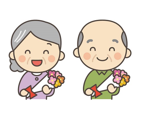 花束を持ったおじいさんとおばあさん